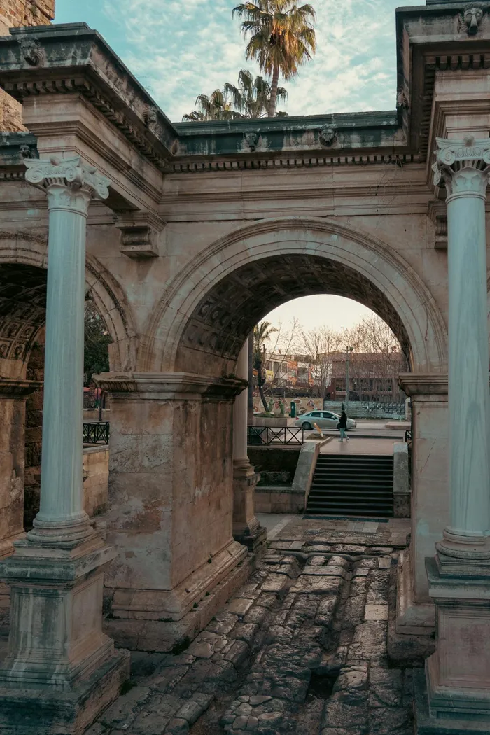 Hadrian's Gate in Antalya, Turkey — the ancient Roman triumphal arch at the entrance to Kaleiçi old town, steps from the city's leading dental clinics