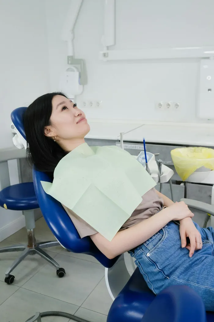 Patient relaxing comfortably in a dental treatment chair — the experience at a properly accredited clinic with good anaesthetic protocols and patient communication